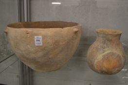 An early terracotta bowl and similar vase.