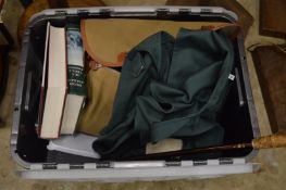 A box of fishing related items.