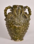 Early 15th Century, a ceramic medieval vessel, scrolling handles and applied decoration, 14.5