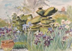 Hermione Hammond (1910-2005), an iris fringed pond and topiary in a garden, watercolour, signed