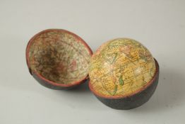A GLOBE with the new discoveries. 7cms dial, in a folding shagreen case.