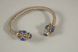 A SILVER SNAKE BRACELET.