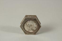 A WHITE METAL OCTAGONAL COIN BOX. 4.5cms.