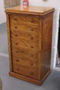 A GOOD 19TH CENTURY SATINWOOD WELLINGTON CHEST of seven drawers, foldover flap, on a platform