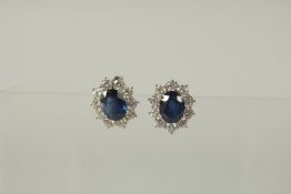 A SUPERB PAIR OF NATURAL SAPPHIRE AND DIAMOND CLUSTER EARRINGS.