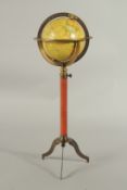 A MINIATURE GLOBE ON A STAND. 37cms high.