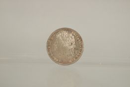 A GEORGE IV LAUREATE HEAD SHILLING, 1825. RARE. G / V F.