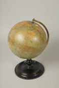 A PHILIP'S 9 INCH TERRESTRIAL GLOBE, on a circular base.