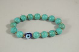 A TURQUOISE AND BEAD BRACELET, boxed.