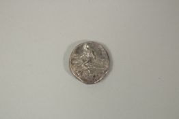 A GREEK SILVER COIN, BOY ON A DOLPHIN.