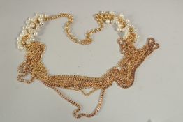 A LONG GILT AND PEARL NECKLACE.