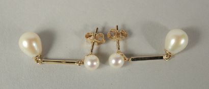 A PAIR OF PEARL AND DIAMOND LONG DROP EARRINGS in 9ct yellow gold.
