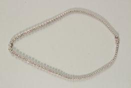A SUPERB 18ct WHITE GOLD AND DIAMOND LINE NECKLACE. With 10.27ct of fine diamonds.