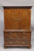 A GOOD EARLY 18TH CENTURY FIGURED WALNUT CHEST ON CHEST, the top with twelve various size drawers