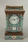 A CLOISONNE ENAMEL REPEATER CARRIAGE CLOCK. 18cms high.