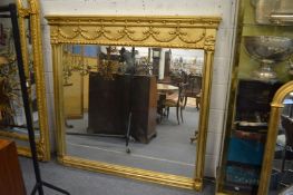 A LARGE GILT FRAMED OVERMANTLE MIRROR 160cm wide x 150cm high.