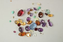 A SMALL BOX OF SEMI-PRECIOUS STONES.
