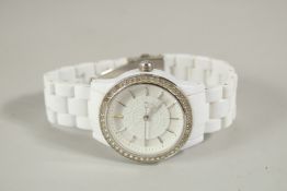 A DKNY WRISTWATCH with white strap. NY / 8011.