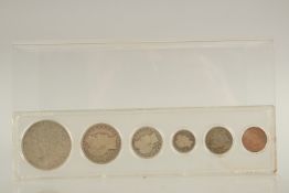 SIX AMERICAN SILVER COINS in a perspex case.