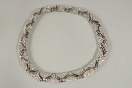 A GOOD DIAMANTE NECKLACE AND CLIP-ON EARRINGS, in a black bag.