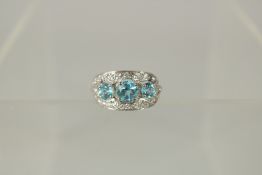 AN EDWARDIAN WHITE GOLD, BLUE ZIRCON AND DIAMOND RING.