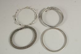 FOUR VARIOUS BRACELETS.