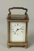 A 19TH CENTURY FRENCH CARRIAGE CLOCK in a leather case. 11cms high.