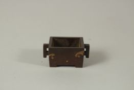 A SMALL CHINESE BRONZE TWO-HANDLED GOLD SPLASH CENSER. 6cms high.
