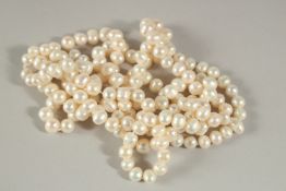 A LONG STRING OF PEARLS. 120cms long.