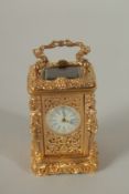 A GOOD CAST BRONZE MINIATURE CARRIAGE CLOCK. 6.5cms high.