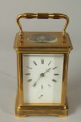 A 19TH CENTURY FRENCH CARRIAGE CLOCK WITH ALARM, in a leather case. 14cms high.