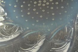 A LALIQUE CIRCULAR BOWL with spiral of fishes. 9.5cms diameter. Etched: R. Lalique, France.