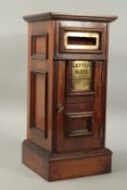 A GOOD GEORGIAN DESIGN MAHOGANY SQUARE POST BOX, with brass letter hole and panel door with brass