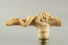 A WALKING STICK with a carved bone handle of a nude.