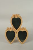 A TRIPLE GILT BRONZE EASEL PHOTOGRAPH FRAME. 32cms.