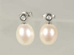 A PAIR OF PEARL AND DIAMOND 18ct GOLD DROP EARRINGS.
