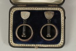 A PAIR OF VICTORIAN SILVER MOUNTED NUT CRACKERS. Sheffield 1891, in a fitted box.