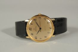 A GENTLEMAN'S 18ct GOLD OMEGA WRISTWATCH with leather strap, in an Omega box.