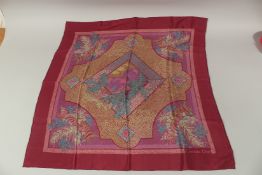 A CHRISTIAN DIOR SILK SCARF. 148cms x 70cms.