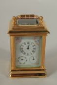 A MINIATURE MULTI-DIAL CARRIAGE CLOCK. 8cms high.