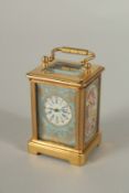 A MINIATURE SEVRES DESIGN CARRIAGE CLOCK. 5.5cms high.