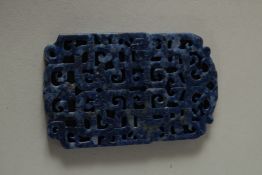 A CARVED AND PIERCED LAPIS PENDANT. 8.5cms x 5cms.