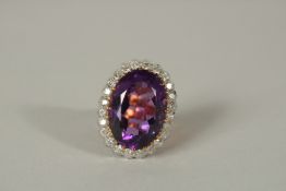 A SUPERB LARGE 18ct GOLD AMETHYST AND DIAMOND RING.