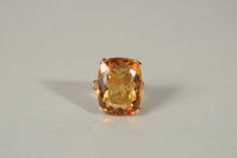 A 9ct YELLOW GOLD, TOPAZ AND DIAMOND RING.