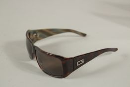 A PAIR OF GUCCI SUNGLASSES, boxed.