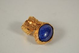 AN YVES ST LAURENT GILT METAL AND LAPIS NECK TIE.