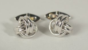 A PAIR OF STERLING SILVER KNOT CUFFLINKS, in a case.