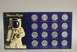 MAN IN FLIGHT. A SET OF SIXTEEN COINS.