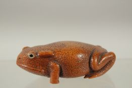 A SUPERB JAPANESE CARVED WOOD FROG with glass eyes. 8.5cms long.