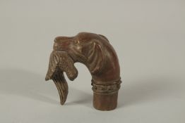 A BRONZE WALKING STICK HANDLE 'HOUND WITH BIRD'.
